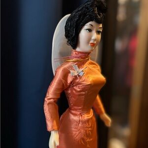 Charming Orange Doll in Traditional Attire